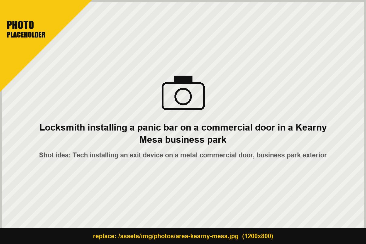 Locksmith installing a panic bar on a commercial door in a Kearny Mesa business park